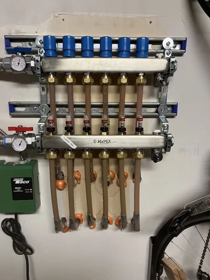 Plumber performing Gas Line Installation at a residential property in Paola